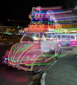 A local grassy open space (alun-alun) serves as the nighttime hangout and food stall foraging (jajan) for locals and tourists